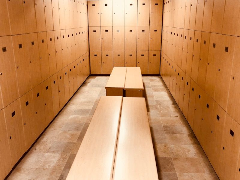 Changing area with timber lockers and bench seating