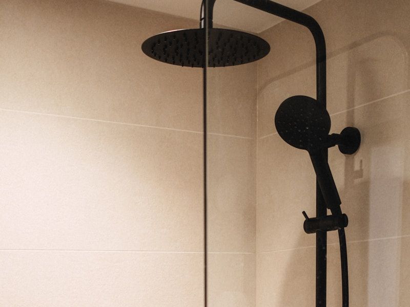 Private shower cubicle with matte black fittings