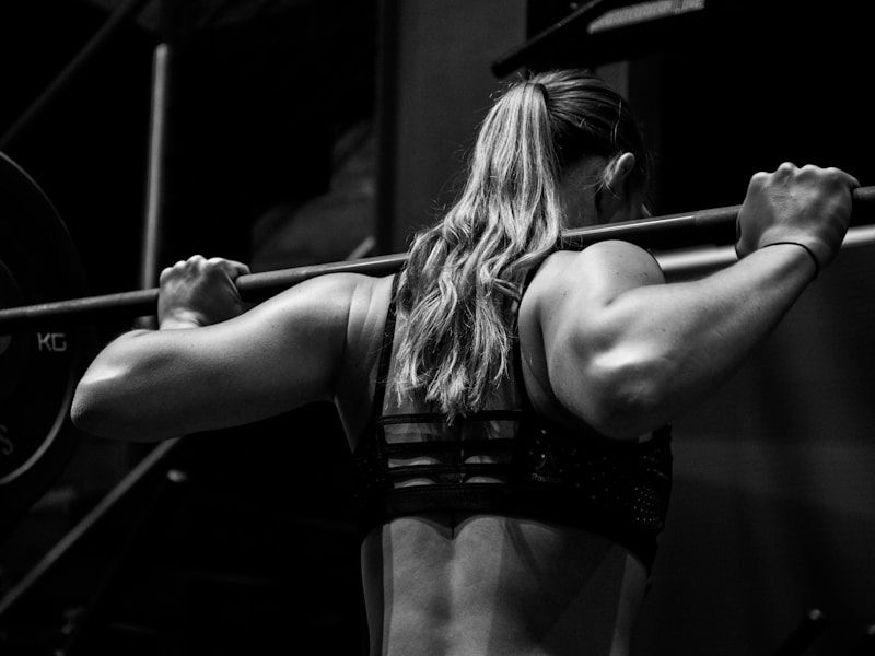 Strength Training at FITZONE — Member setting up for a heavy barbell back squat